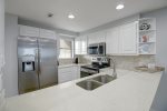 Updated galley kitchen with stainless appliances